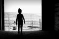 Silhouette of girl in barn door Royalty Free Stock Photo