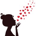 Silhouette of a girl blowing hearts away