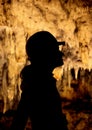 A silhouette of a girl in caves