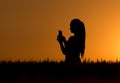 Silhouette of girl with cell phone Royalty Free Stock Photo