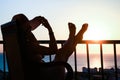 Silhouette of a girl on a chair on a nature background Royalty Free Stock Photo