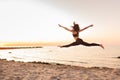 Silhouette of girl dancer in a split with sunset or sunrise background and copy space. Concept of heathy life, goob body and youth