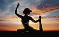 Silhouette of girl doing yoga over sunset Royalty Free Stock Photo