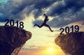 Silhouette the girl jump to the New Year 2019. Royalty Free Stock Photo