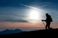 Silhouette of a girl on a mountain during a religious trek in a