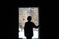 Silhouette of a girl in open doorway Royalty Free Stock Photo