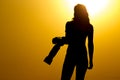 Silhouette of a girl photographer at sunset Royalty Free Stock Photo