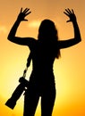 Silhouette of a girl photographer at sunset Royalty Free Stock Photo