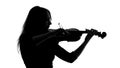 Silhouette of a girl playing the violin