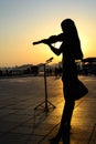 Silhouette of Girl playing the violin Royalty Free Stock Photo