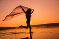 Silhouette of girl running on the beach Royalty Free Stock Photo