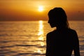 Silhouette of a girl's profile against the background of the sea