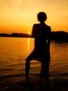 Silhouette of a girl in the sunset