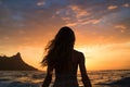 Silhouette of a girl in a swimsuit on the beach at sunset, Female surfer rear view in sea at sunset, Oahu, Hawaii, United States