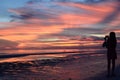 Silhouette of a girl taking a photo at dusk. White beach, station one. Boracay Island. Western Visayas. Philippines Royalty Free Stock Photo