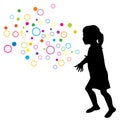 Silhouette of a girl trying to catch circles