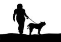 Silhouette girl walks with the dog