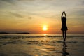 Silhouette Girl welcome sunrise on beach