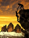 Silhouette of girls climbing on the rock. Royalty Free Stock Photo