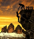 Silhouette girls climbs into the New Year 2015