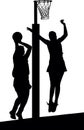 Silhouette of girls netball players jumping and blocking