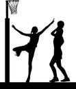 Silhouette of girls netball players jumping and blocking Royalty Free Stock Photo