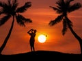 Silhouette golfer hitting golf shot on sunset Royalty Free Stock Photo