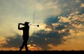 Silhouette golfer playing golf at beautiful sunset Royalty Free Stock Photo