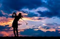 Silhouette golfer playing golf at beautiful sunset