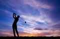 Silhouette golfer playing golf at beautiful sunset Royalty Free Stock Photo