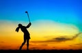 Silhouette golfer playing golf at beautiful sunset Royalty Free Stock Photo