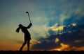 Silhouette golfer playing golf at beautiful sunset Royalty Free Stock Photo