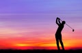 Silhouette golfer playing golf at beautiful sunset Royalty Free Stock Photo