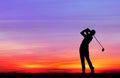 Silhouette golfer playing golf at beautiful sunset Royalty Free Stock Photo