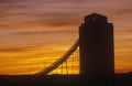 Silhouette of grain silo, sunset Royalty Free Stock Photo