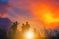 Silhouette of Grandfather grandmother granddaughter and grandchild playing and walking evening sunset background, Happy family