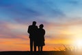 Silhouette of Grandfather grandmother, Senior couple walking evening sunset background, Happy elderly couple concept