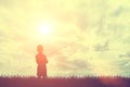 Silhouette grass and little boy fishing with sky and clouds during sunset