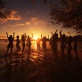 Silhouette of a young women on a sunset beach. Jumping young girls with reflection on the beach. Royalty Free Stock Photo