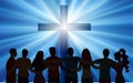 Silhouette group of embraced people looking at the luminous Christian cross.Concept Resurrection Jesus Christ. Easter. Crucifix wi Royalty Free Stock Photo