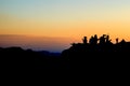 Silhouette group friend travel to Mountain isolate with twilight background.