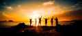 Silhouette of group of friends are having fun, having fun on the beach in the evening sunset Royalty Free Stock Photo