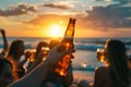 Silhouette of a group of friends having a party on a beach at sunset drinking beer Royalty Free Stock Photo
