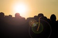 Silhouette of group of friends walking in the city during sunset against sky Royalty Free Stock Photo