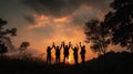 Silhouette of group happy business team making high hands over head in beautiful sunset sky evening time Royalty Free Stock Photo