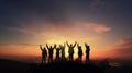 Silhouette of group happy business team making high hands in sunset sky,success and teamwork Royalty Free Stock Photo