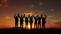 Silhouette of group happy business team making high hands in sunset sky,success and teamwork Royalty Free Stock Photo