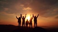 Silhouette of group happy business team making high hands in sunset sky,success and teamwork Royalty Free Stock Photo