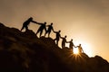 Silhouette Group of hiker help each others during hiking on the moutain together, generative ai