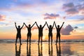 Silhouette group of people holding hands, beach, friendship, teamwork, success Royalty Free Stock Photo